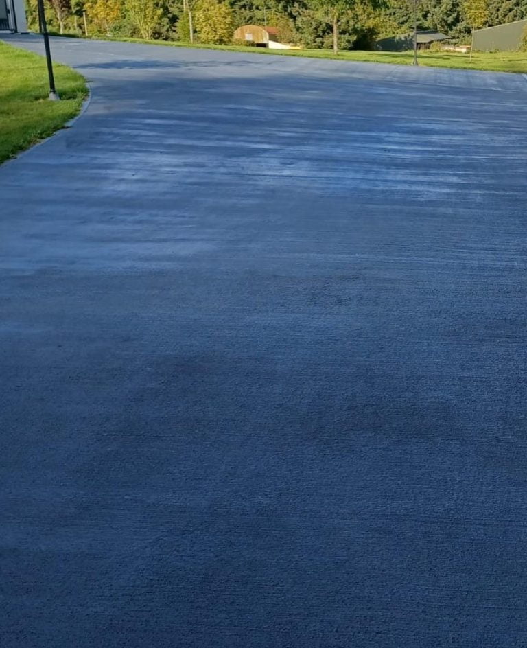 brushed coloured concrete driveway